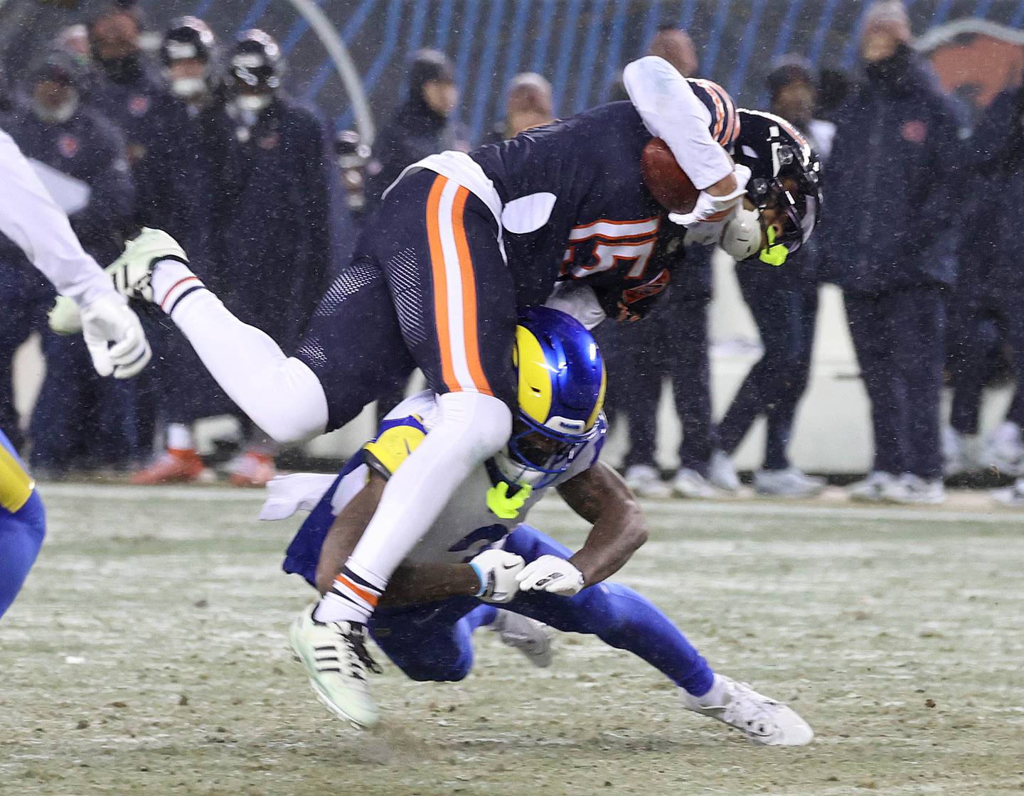Chicago Bears wide receiver Rome Odunze is tripped up by Los Angeles Rams safety Kam Curl Sunday, Jan. 18, 2026, during their NFC divisional playoff matchup at Soldier Field in Chicago.