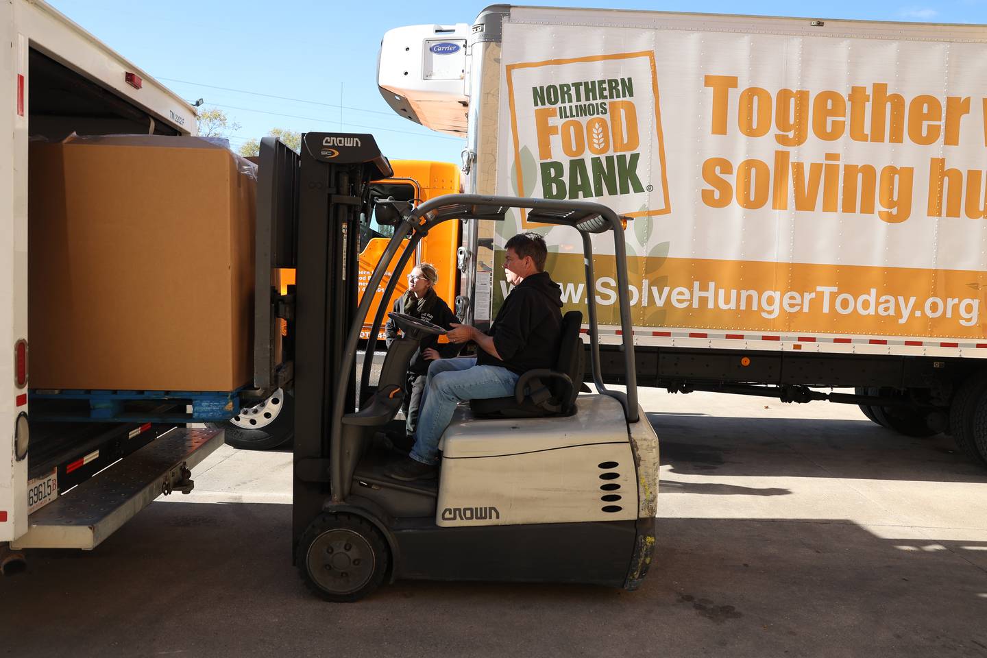Steve Harold, processing coordinator at the Northern Illinois Food Bank South Suburban Center in Joliet, loads a pallet of meat into a truck for Rainah Runty of Big Wolf Ranch Rescue in Lockport on Tuesday, Nov. 12, 2024 in Joliet.
