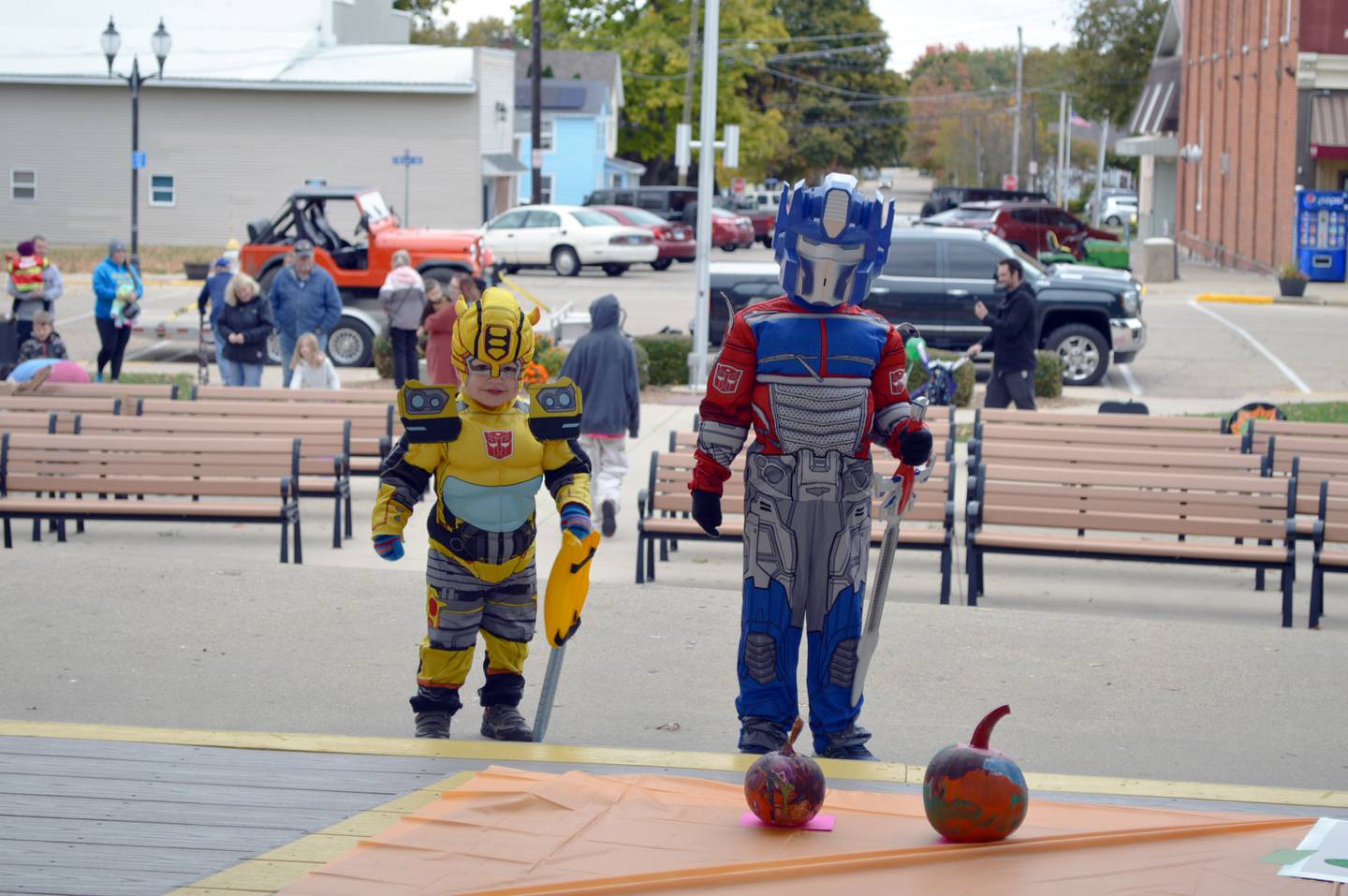 Ellis Fry, 2, left, and Harlan Fry, 5, both of Polo, pose for a photo after dropping off their entries in the pumpkin carving contest during the Family Fall Festival at the Mt. Morris village square on Oct. 16. The brothers' Transformers costumes were two of many costumes worn to the event by attendees. This was the festival's first year; it serves as an additional fundraiser for the Let Freedom Ring Fourth of July fireworks.