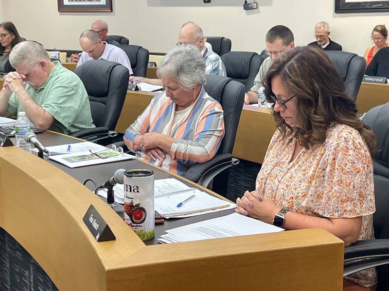 Heads down for Joe. Members of the La Salle County Board observe a moment of silence Thursday, May 11, 2023, to honor colleague Joe Witczak (D-Peru), who died recently at age 60.