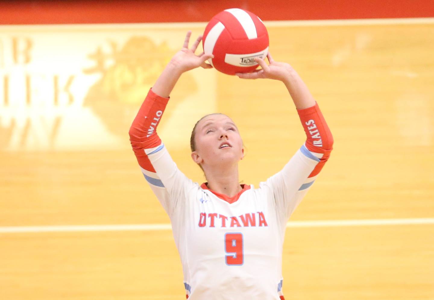 Ottawa's Skylar Dorsey sets the ball in the air against La Salle-Peru in a match this past season in Kingman Gym at Ottawa High School.