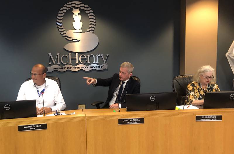 McHenry Mayor Wayne Jett, left, will face off against 4th Ward Alderwoman Chris Bassi, right, who is also running for mayor in the April 1, 2025, elections. The two sit on either side of City Attorney David McArdle during the Sept. 16, 2024, city council meeting.