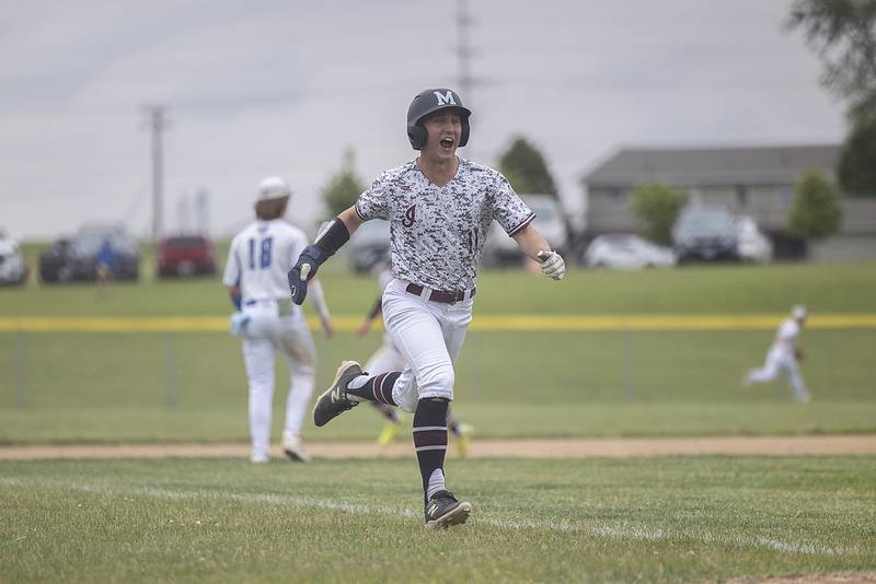 Marengo’s Alten Bergbreiter comes in to score a run against Newman Wednesday, May 28, 2025, in the Class 2A Sectional semifinal in Mendota.