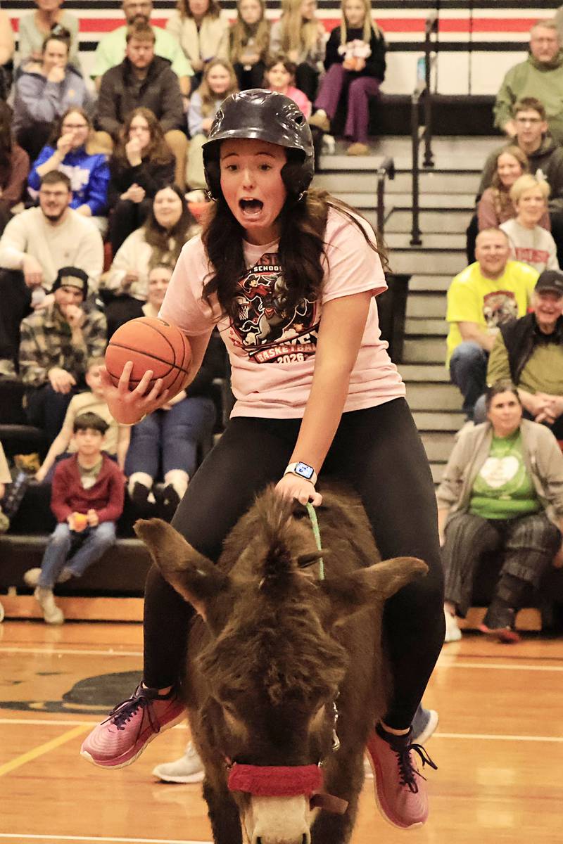 After spending several minutes trying to get her donkey to move, Maddi Porter was slightly startled when he started to trot away.