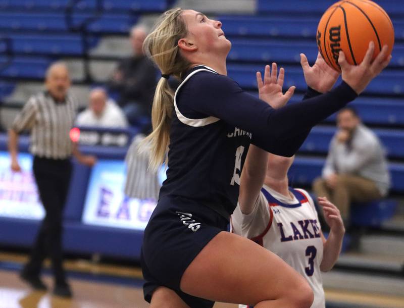 Cary-Grove’s Malaina Kurth takes the ball to the net against Lakes in varsity girls basketball action on Friday, Jan. 2, 2026  at Lakes High School in Lake Villa.