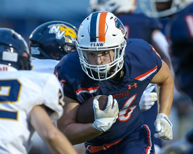 Oswego's Dekker Zelensek (26) runs with the ball during a football game between Neuqua Valley and Oswego on Friday, Aug. 30, 2024 in Oswego. Gary E Duncan Sr for Shaw Local News Network.