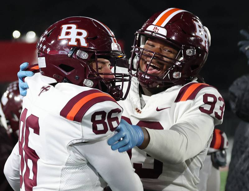 Brother Rice players celebrate as time ticks away Wednesday, Dec. 3, 2025, during their IHSA Class 7A state chamionship win over St. Rita in Huskie Stadium at Northern Illinois University in DeKalb.