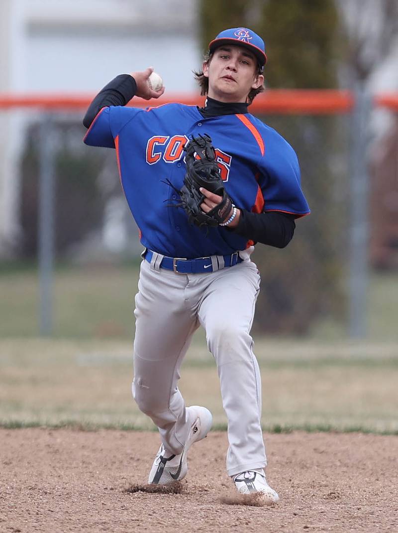 Genoa-Kingston's Brycen Lavender fires the ball to first to get a Winnebago base runner during their game Tuesday, April 12, 2022, at Genoa-Kingston High School.