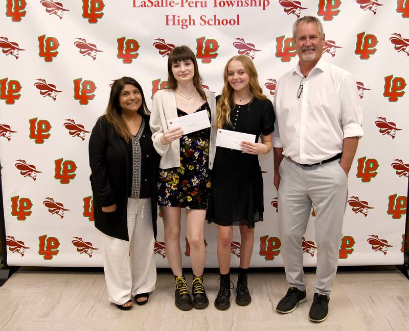 Nora Maier (middle left) and Aidan Harmon (middle right) each received a $1,000 the Jaiden Allen Memorial Scholarship, established in memory of Jaiden Allen and sponsored by his parents, Andrew Allen (right) and Sangita Patel Allen (left). The memorial scholarship is awarded to any graduating senior who has a minimum GPA of 3.25, is accepted to a two- or four-year college full-time, demonstrates participation in school-community activities and submits an essay about "how you plan to make the world a better place and in what ways are you already doing so?"