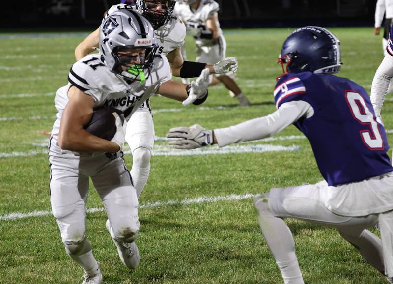 Kaneland's Brady Brown looks to get past Belvidere North's Nolan Vaughn Friday, Nov. 7, 2025, during their Class 5A second round playoff game at Belvidere North High School.