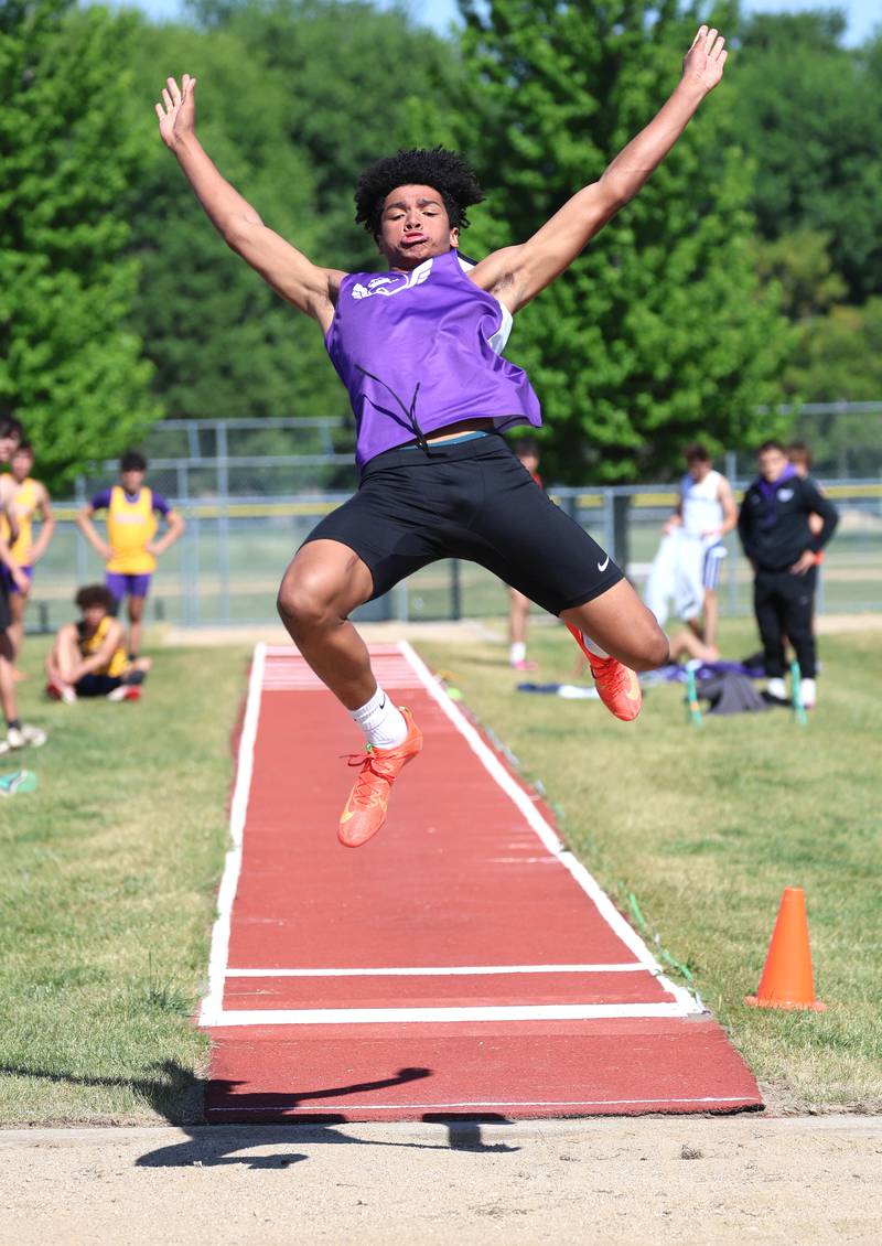 Dixon’s Xavion Jones takes his attempt at the long jump Wednesday, May 20, 2026, during the Class 2A boys track sectional at Rochelle High School.