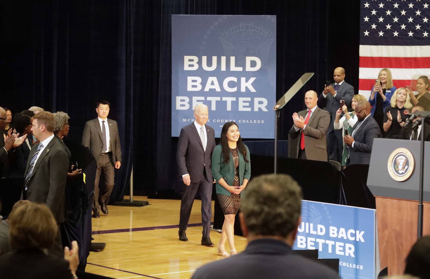 President Joe Biden walks in with Edith Sanchez, McHenry County College student trustee for the 2021-22 school year, before speaking at McHenry County College Wednesday, July 7, 2021, in Crystal Lake.