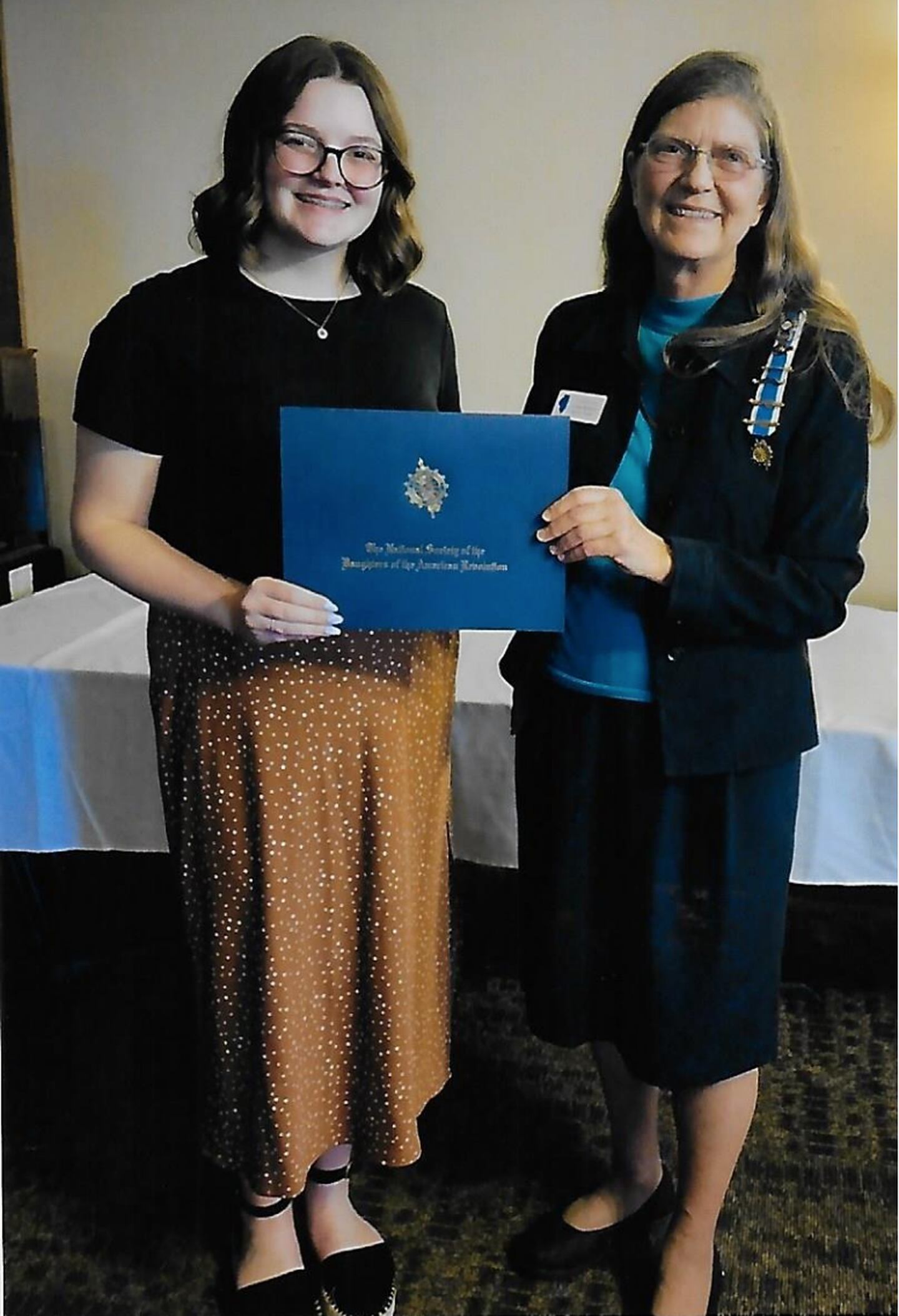 Isabella Hagenbuch, a senior at St. Bede Academy, is pictured with Illinois Daughters of American Revolution District II Good Citizens Chair, Lydia Roberts.