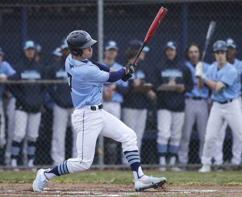 Downers Grove South’s John Szalko makes contact against Willowbrook during a game in Downers Grove on Tuesday, April 5, 2022.
