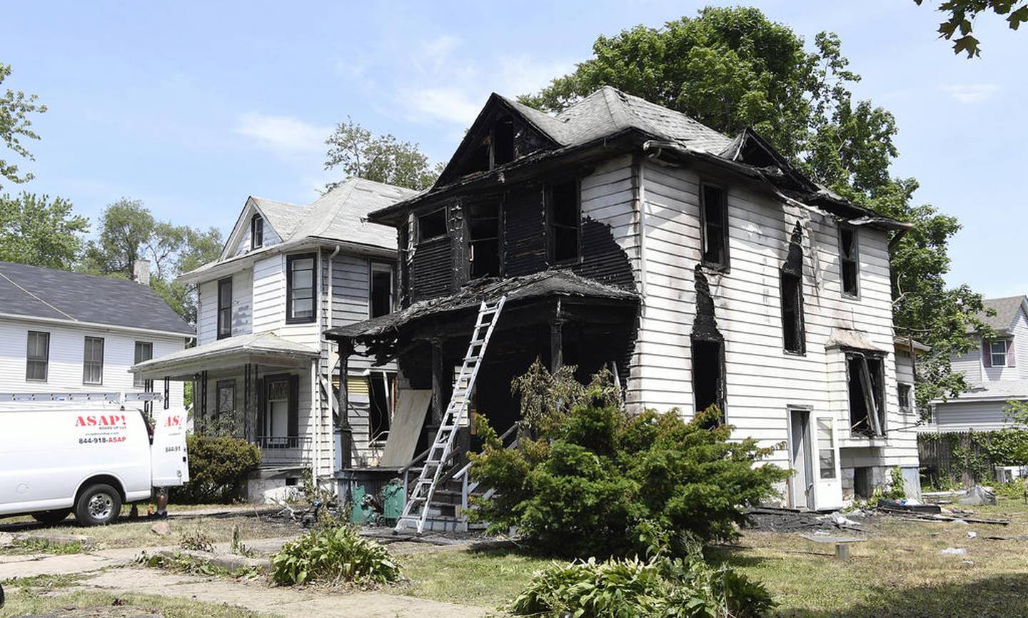 ASAP Board Up Service and XR Expert Restoration working on the house at 16 S. Center from an overnight fire the left three dead in Joliet, Ill. on Saturday, June 03, 2017.
