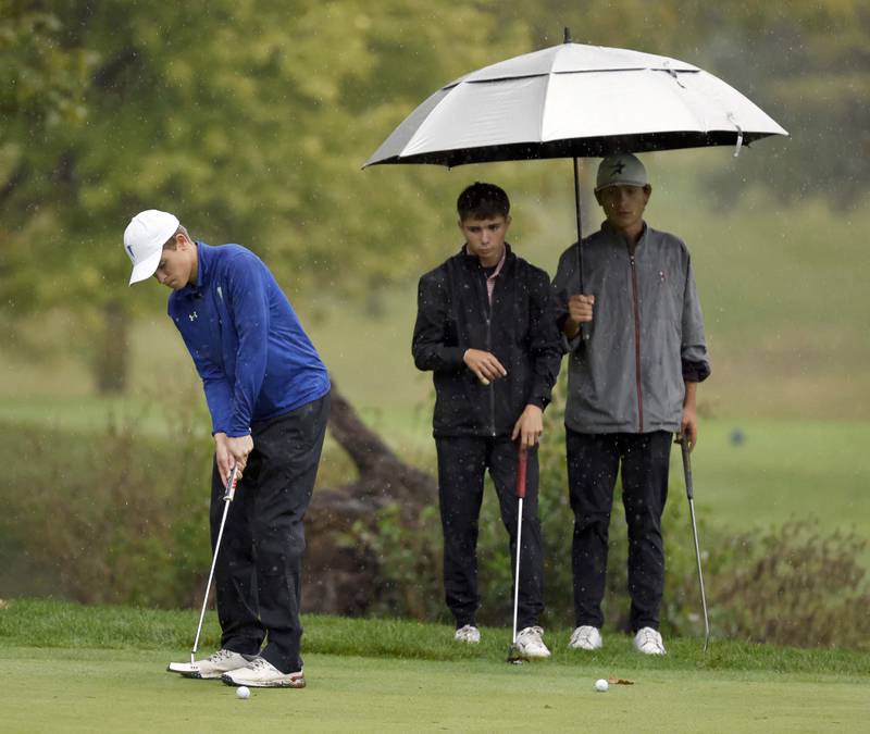 Trey Hubner, Wheaton North, putts during the DuKane Conference Boys Varsity Tournament Tuesday, Sept. 24, 2024 Bartlett Hills Golf Club.