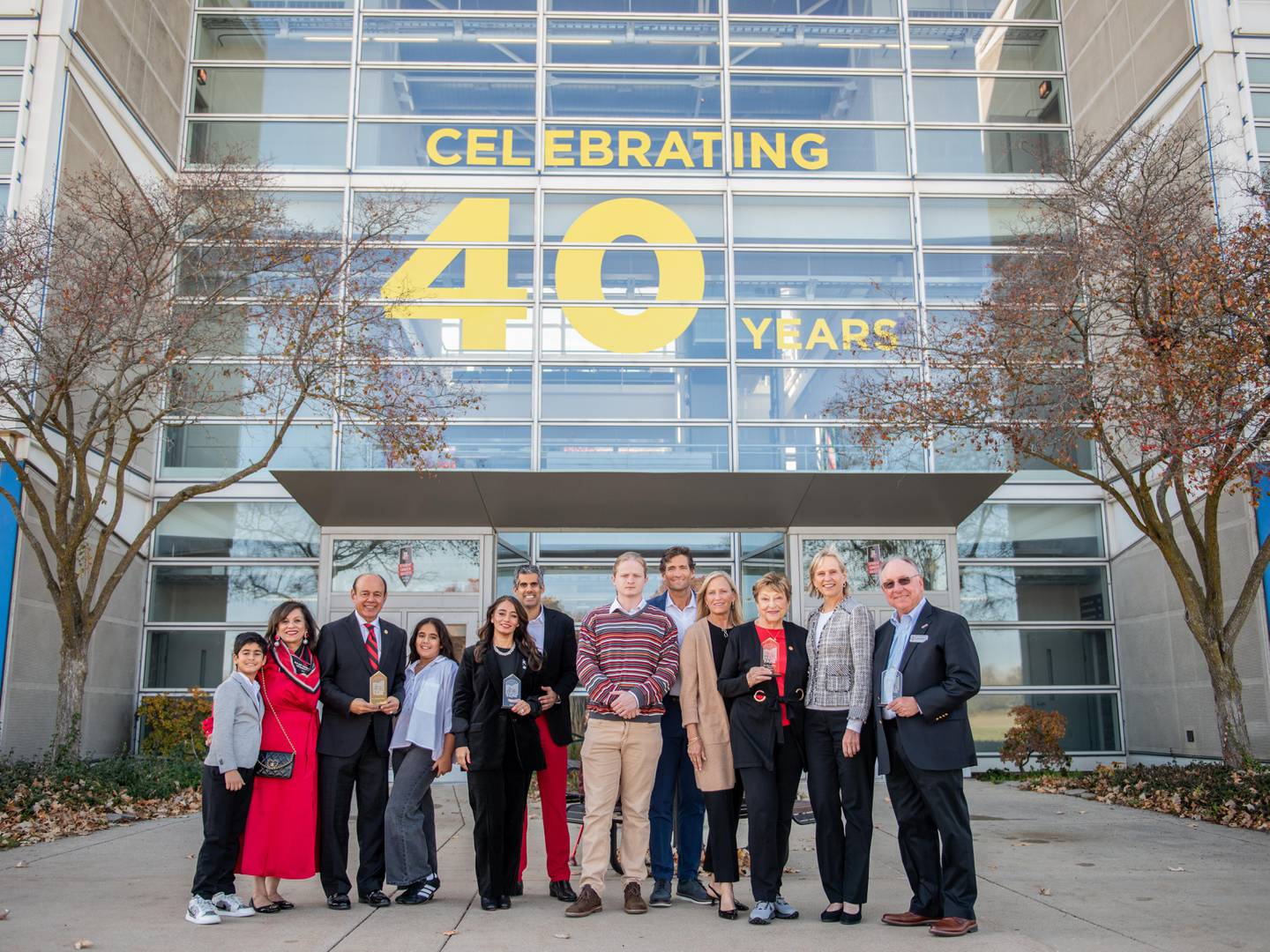 The four inaugural inductees to NIU's College of Engineering and Engineering Technology (CEET) Hall of Fame pose with family: Inductees are Romualdas "Rom" Kasuba (posthumously), Promod Vohra, Joe Sener and Divya Behl. Kasuba and Vohra were the college's first two deans, and Sener and Behl are distinguished alumni. They were honored on Nov. 14, 2025, in a ceremony at NIU's Engineering Building that also commemorated CEET's 40th anniversary.