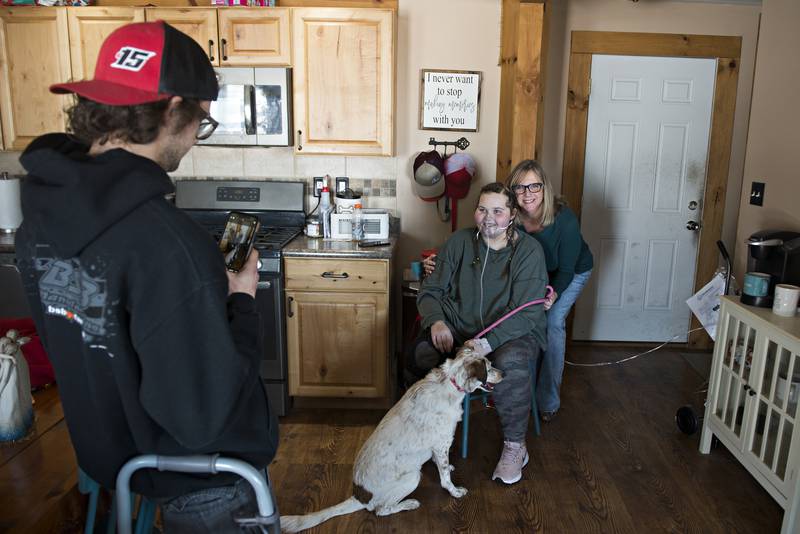 Brandon snaps a picture of Carlie, Tracy and Bella. One of the things Carlie is looking forward to is “just sitting on my own couch.”