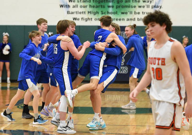 Geneva players celebrate their win over Wheaton Warrenville South during the Class 4A Bartlett Sectional semifinals Wednesday.