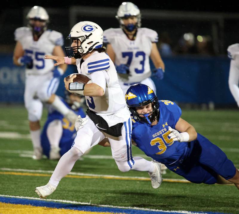 Geneva's Nate Stempowski (3) heads upfield as Lake Forest's Timotei Dan (35) tries to make a diving tackle during the IHSA Class 6A playoff game Friday November 3, 2023 in Lake Forest.