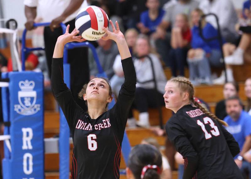 Indian Creek's Isabella Turner sets the ball for teammate Allie Peterson during their match Tuesday, Sept. 24, 2024, at Hinckley-Big Rock High School.