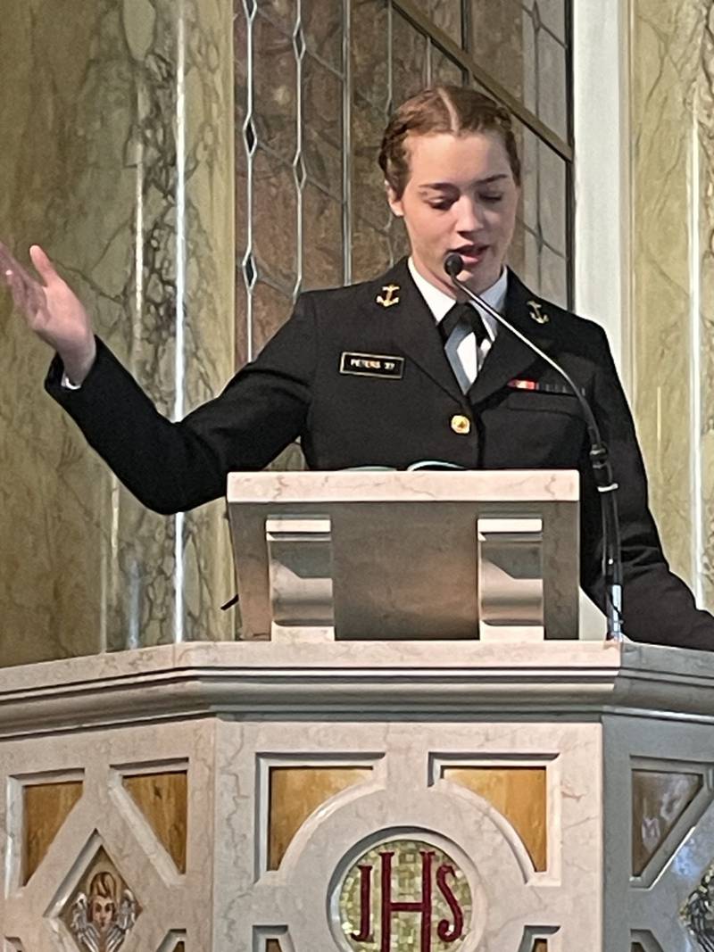 Students at Trinity Catholic Academy in La Salle celebrated the last day of school before Christmas break, Wednesday, Dec. 20, 2023, with a special guest at Mass in Queen of the Holy Rosary Shrine. Midshipman Sarah G. Peters, a 2018 graduate of TCA and 2022 graduate of La Salle-Peru Township High School, is a student at the U.S. Naval Academy in Annapolis, Maryland. Peters sings with the USNA Women’s Glee Club, which performs the national anthem at sporting events and at musical events across the globe. Peters will perform with the Glee Club in Japan this March as part of a cultural exchange.