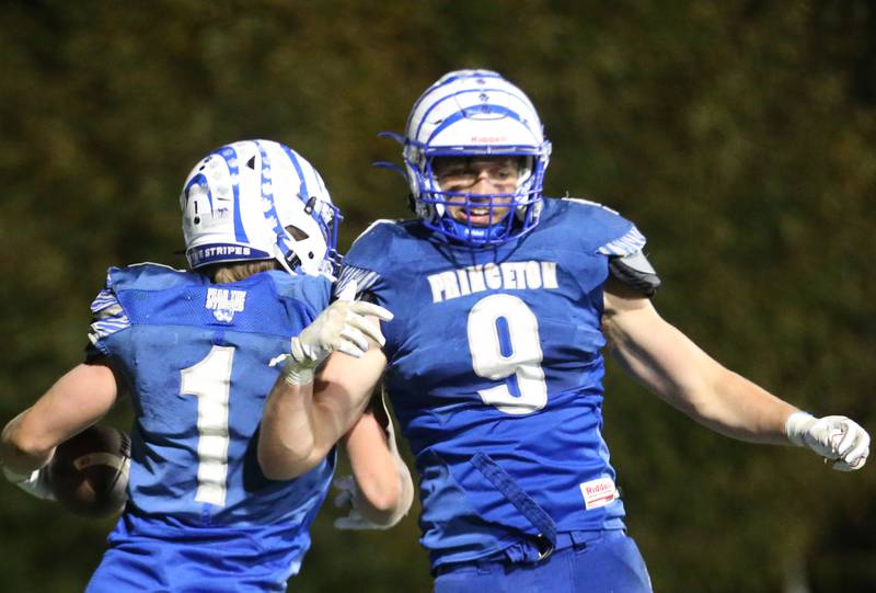 Princeton's Casey Etheridge and Arthur Burden celebrate after scoring a touchdown against Oregon during the Class 3A playoff game on Friday, Nov. 1, 2024 at Princeton High School.