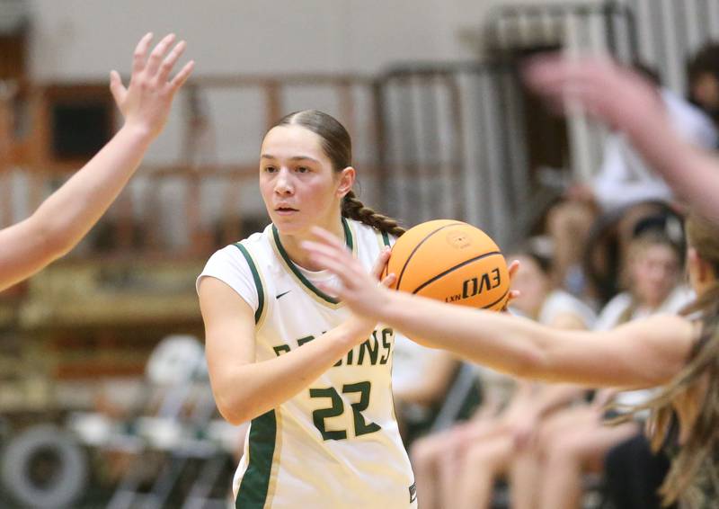 St. Bede's Hannah Heiberger looks to pass around Midland defenders on Thursday, Dec. 4, 2025 at St. Bede Academy.