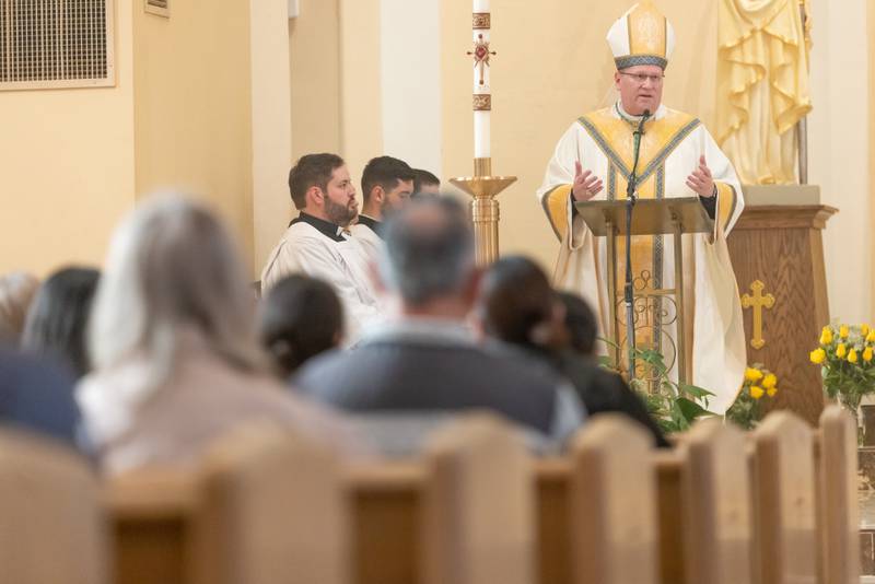 Bishop Louis Tylka speaks to the crowd at Mass at St. Hyacinth Church in La Salle during the National Eucharistic Pilgrimage on Monday, May 19, 2025.