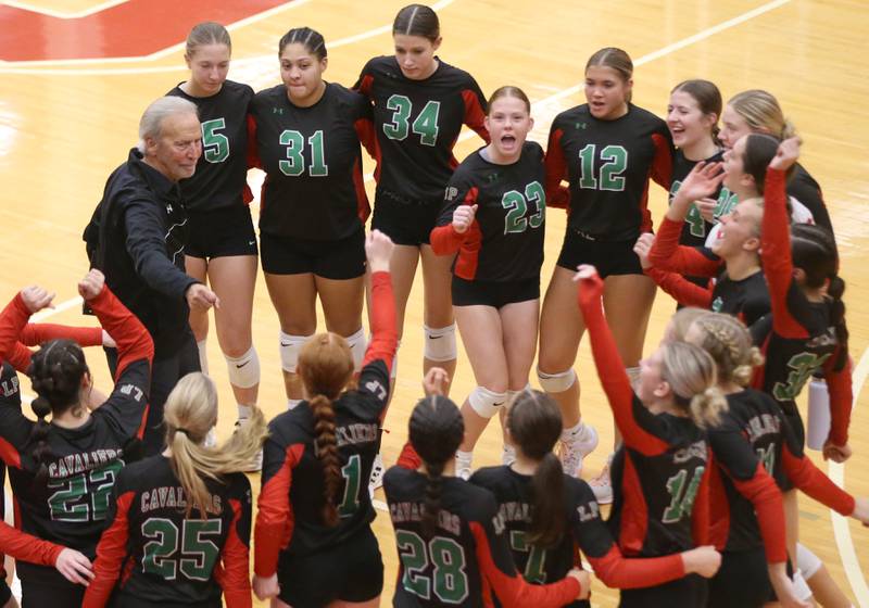 L-P head volleyball coach Mark Haberkorn smiles with his team after defeating Ottawa on Thursday, Sept. 21, 2023 at Kingman Gym.