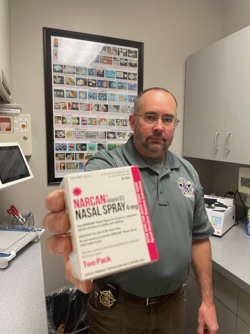La Salle County Coroner Rich Ploch reported Nov. 20, 2023, that fatal overdoses are projected to tumble 66% by year's end. In his hand is one of the reasons why. Naloxone, sold over the counter as Narcan nasal spray, reverses opiod overdoses and its increased availability is helping to save lives.