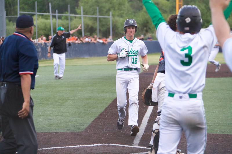 York's Josh Fleming scores a run against St. Charles East at the Class 4A Sectional Semi Final on Wednesday, May 31, 2023 in Elgin.