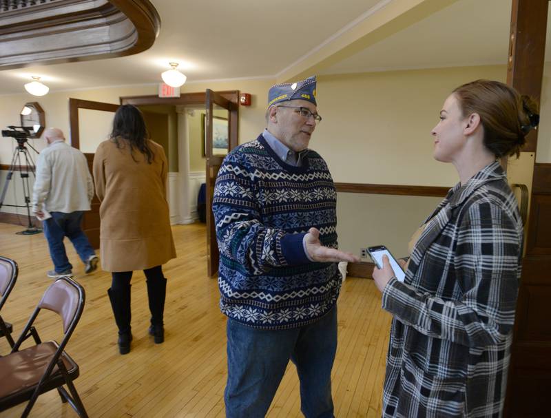 Jim Connelly of LaGrange talks with Sean Casten's District Director Laura Schock prior to the arrival of U.S. Rep. Sean Casten, D-Downers Grove, during the town hall held Saturday Jan 21, 2023.