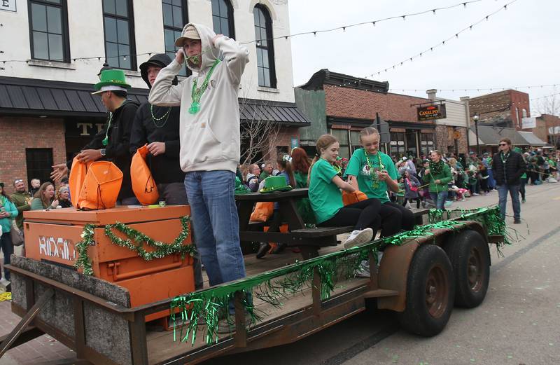 The Bruce and Ollie's float travels on Mill Street during the St. Patrick's Day parade on Saturday, March 15, 2025 downtown Utica.