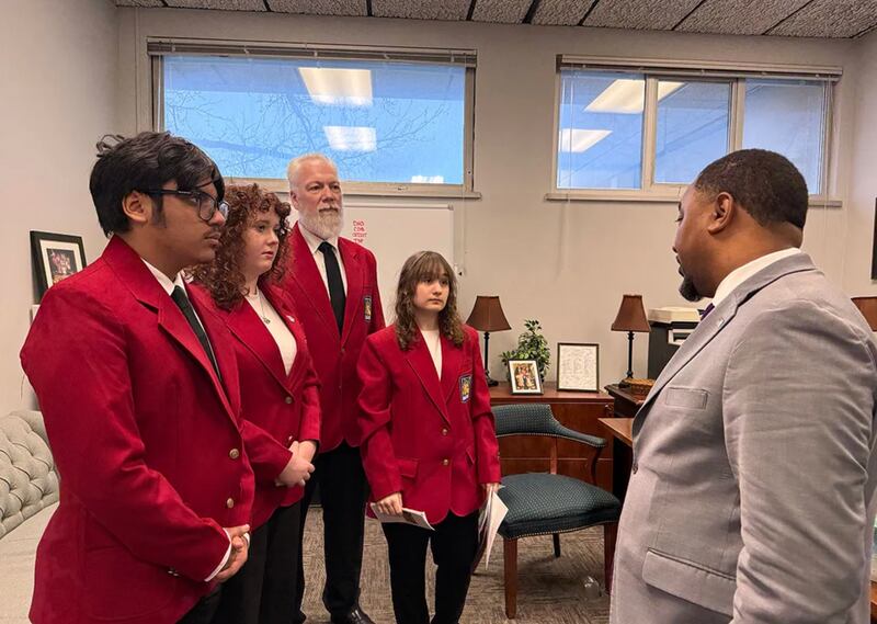 Argo Community High School sophomores Luciana Deir (second from left) and Angelica Turza (fourth from left) along with another student and their teacher meet with State Sen. Willie Preston (D-Chicago)