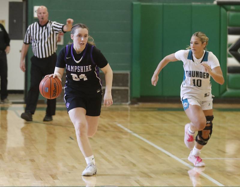 Hampshire's Whitney Thompson brings the ball up the court against Woodstock North's Addison Rishling during the girl’s game of McHenry County Area All-Star Basketball Extravaganza on Sunday, April 14, 2024, at Alden-Hebron’s Tigard Gymnasium in Hebron.