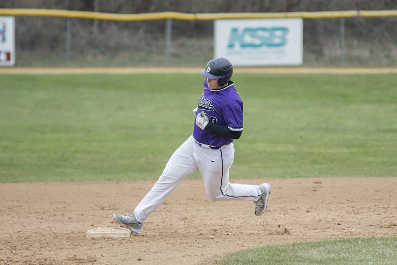 Dixon's Mike Bivins rounds second base Tuesday, April 5, 2022 against Oregon.