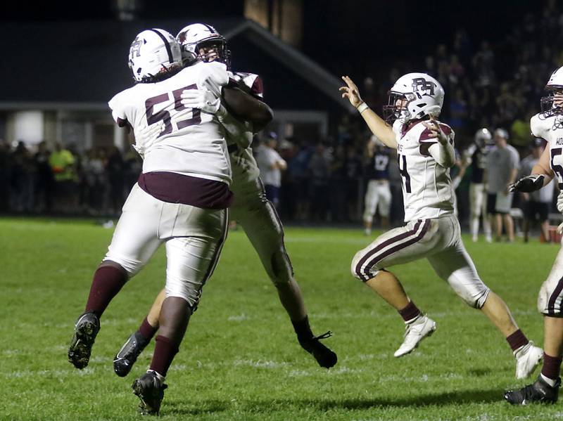 Prairie Ridge's Gavin Tinch and Logan Thennes hug as they celebrate a missed extra point that secured a 21-20 win over Cary-Grove in a Fox Valley Conference football game on Friday, Sept. 22, 2023, at Cary-Grove High School in Cary.