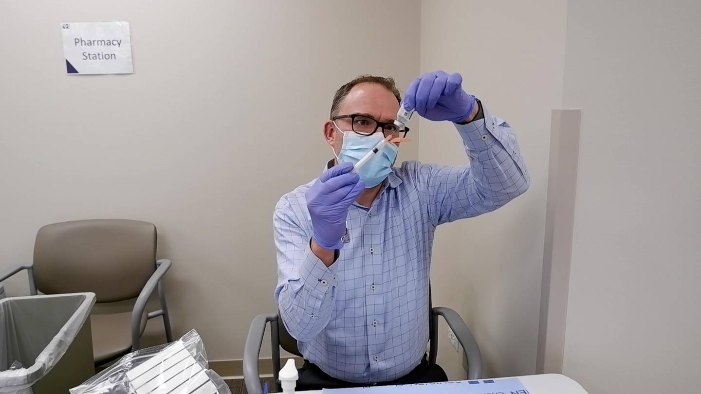 Pharmacist Erick Borkowski prepares a dose of the Moderna COVID-19 vaccine Jan. 29, 2021, at Northwestern Medicine Woodstock Hospital.