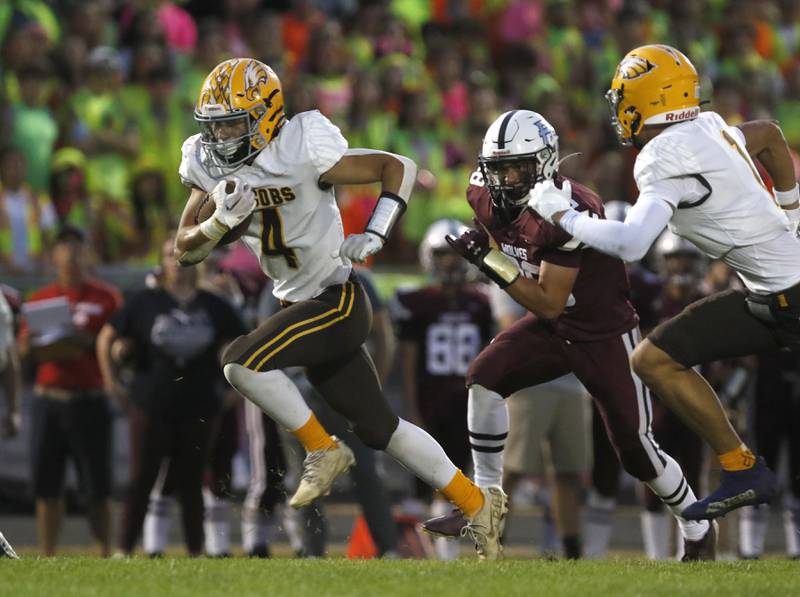 Jacobs' Joey Scrivani runs with the ball during a Fox Valley Conference football game between Jacobs and Prairie Ridge Friday, Sept. 16, 2022, at Jacobs High School in Algonquin.