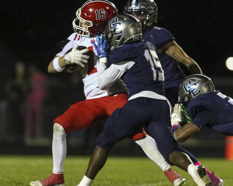 Oswego East's Jamari Mckay (15) knocks down Yorkville's Joel Castillo (16) before he can score a touchdown off of a slant route during football game between Yorkville at Oswego East Friday, Oct 10, 2025 in Oswego.