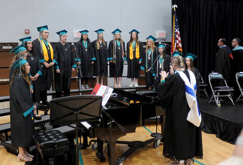 Choral graduates sing the “Star-Spangled Banner” Saturday, May 14, 2022, during the graduation ceremony at Woodstock North High School.