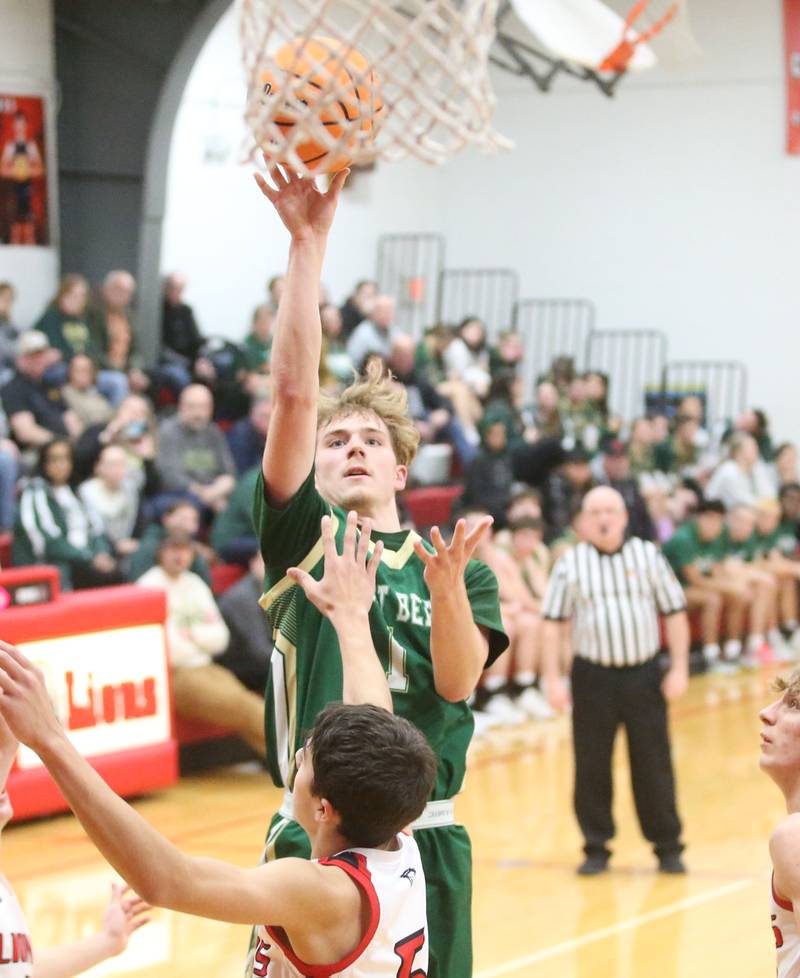 St. Bede's Kaden Newman lets go of a shot in the lane over LaMoille's Braden Fischer on Tuesday, Feb. 11, 2025 at LaMoille High School.