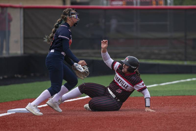 Yorkville's Kayla Kersting (10) slides into third for a triple during softball game between Oswego at Yorkville. May 5, 2026 in Yorkville.