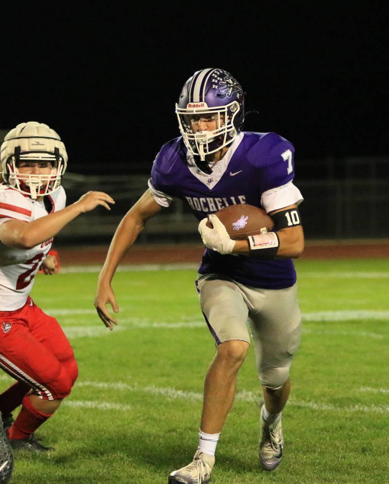 Rochelle's Mark Green (7) runs the ball during Friday's game with Ottawa in Rochelle.