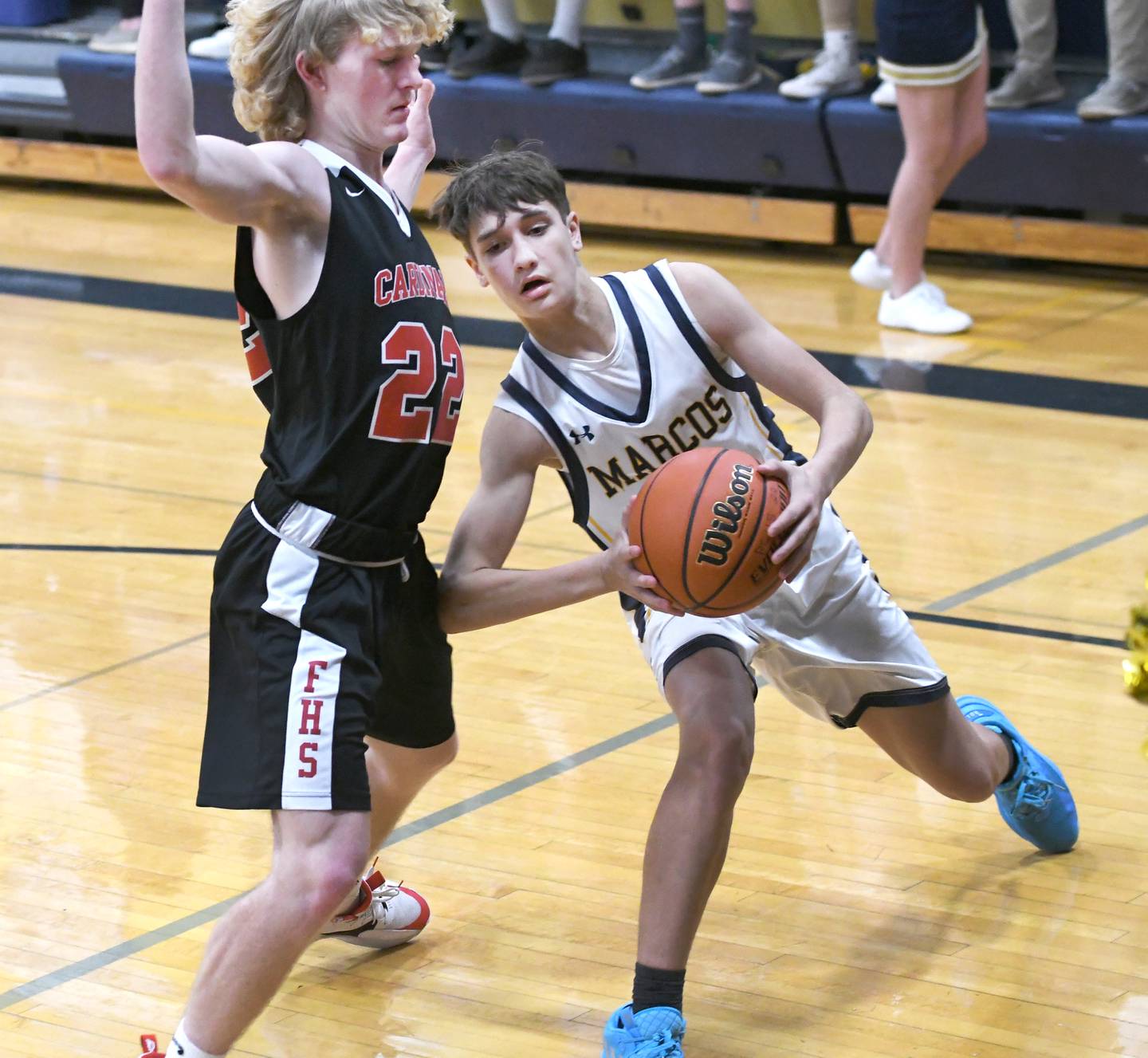 Polo's Gus Mumford (5) puts on the brakes as he drives the baseline and is stopped by Forreston's Quentin Frederick (22) during a NUIC game in Polo on Thursday, Jan. 19.