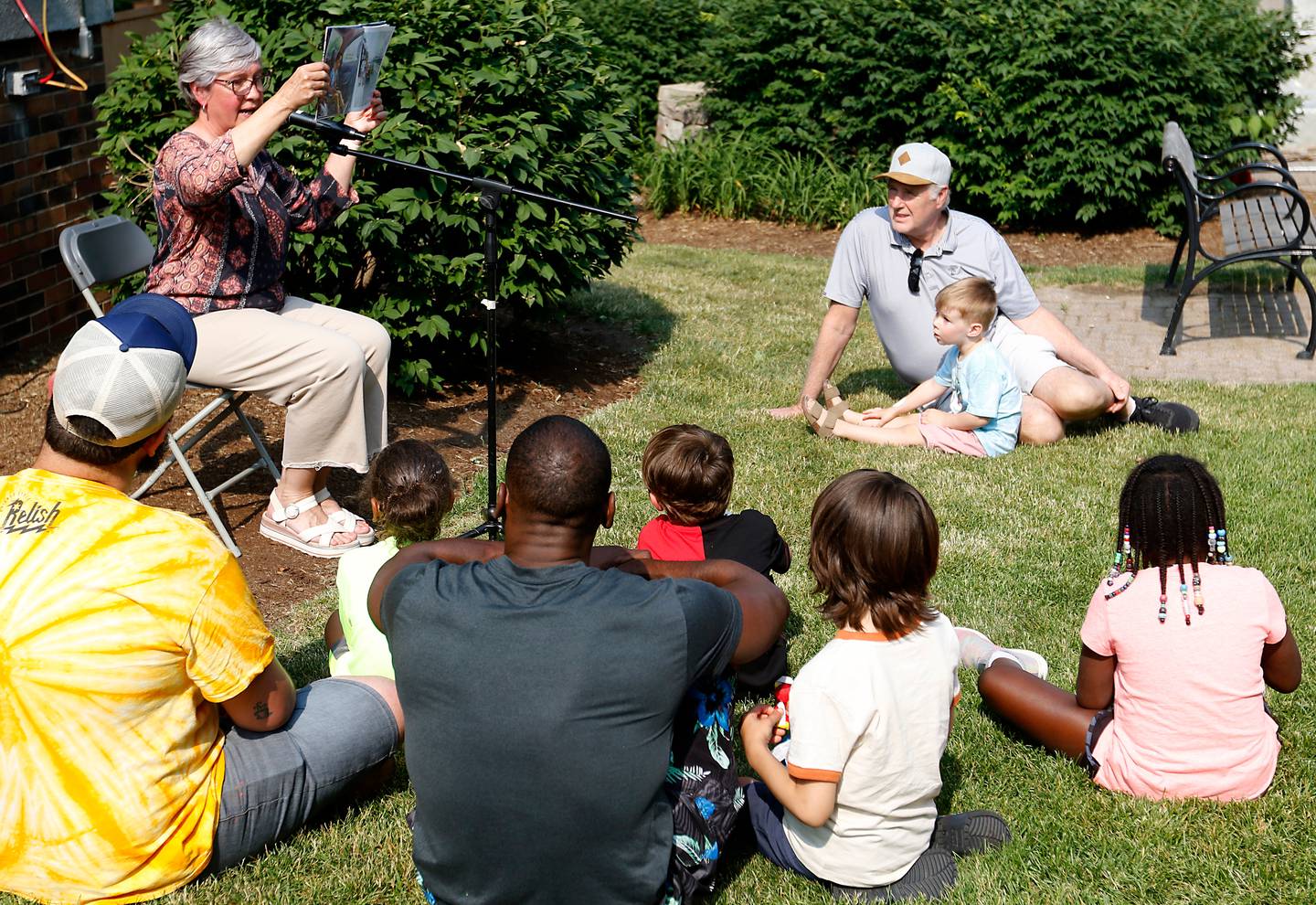 Arlene Lynes of Read Between The Lynes  reads a book about Juneteenth during McHenry County’s first Juneteenth celebration on Saturday, June 17, 2023, at the Historic Woodstock Square. The Juneteenth festival featured McHenry County College graduate Rodney Katushabe and Pastor Norval Brown of the Cary United Methodist Church, along with music from gospel singer Darlene Benton and jazz musician Ken Davis.
