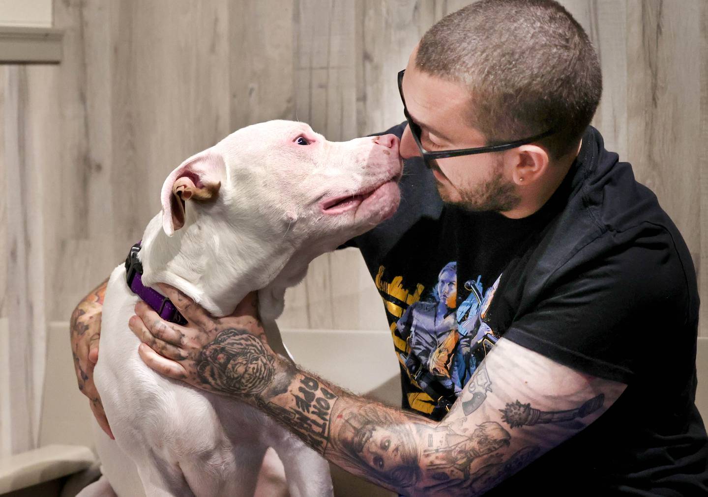 Jesse Rubo, from Malta visits with a mixed breed dog named Blue Monday, July 24, 2023,  to see if they are a match for adoption at Tails Humane Society in DeKalb. Tails will be hosting  the Tails on Tap Bar Crawl Saturday Aug. 5 in downtown DeKalb with all proceeds benefitting the homeless pets at the shelter.