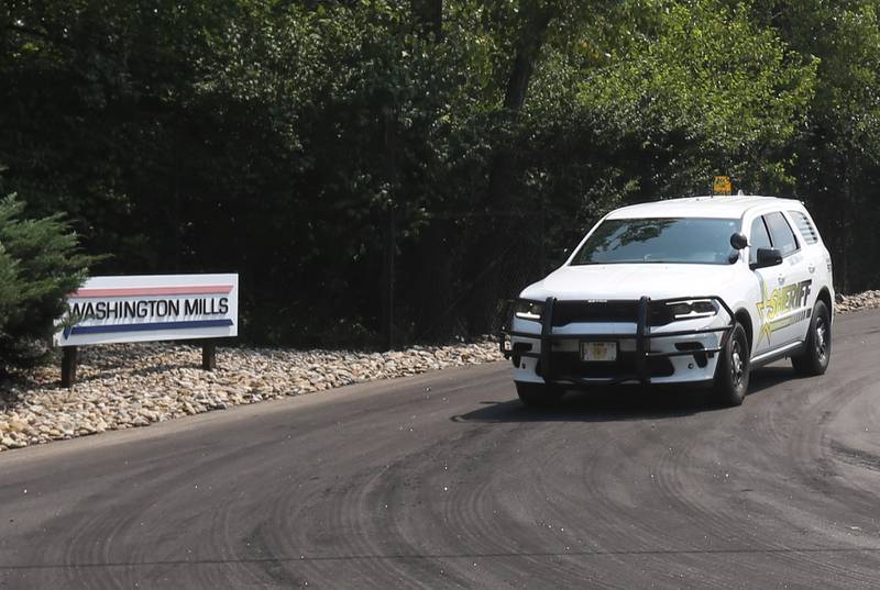 A Putnam County Sheriff vehicle watches the entrance at Washington Mills for a structure fire on Monday, Aug. 18, 2025 near Hennepin. a Mutual Aid Box Alarm System (MABAS) call was placed shortly after 11a.m. Fire departments from La Salle, Bureau and Putnam Counties assisted with the fire.