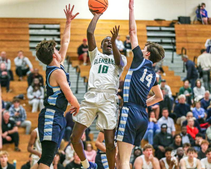 Glenbard West's Josh Abushanab (10) puts up a shot during their Jack Tosh Holiday Classic basketball tournament game between Nazareth vs Glenbard West. Thursday Dec 26, 2024 in Elmhurst.